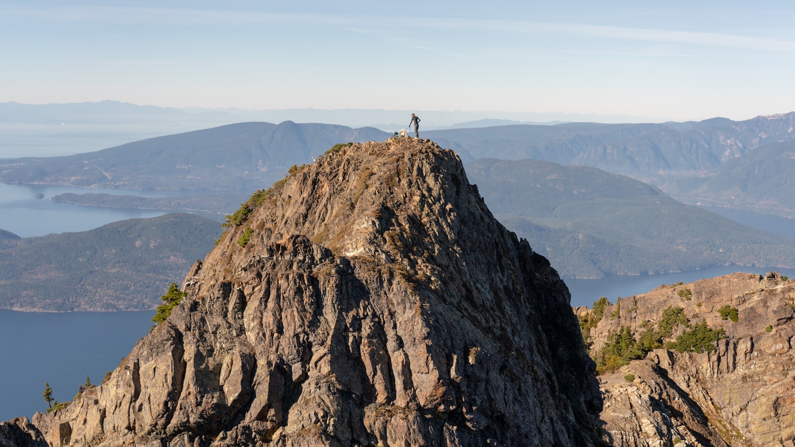 person standing on top of mountain