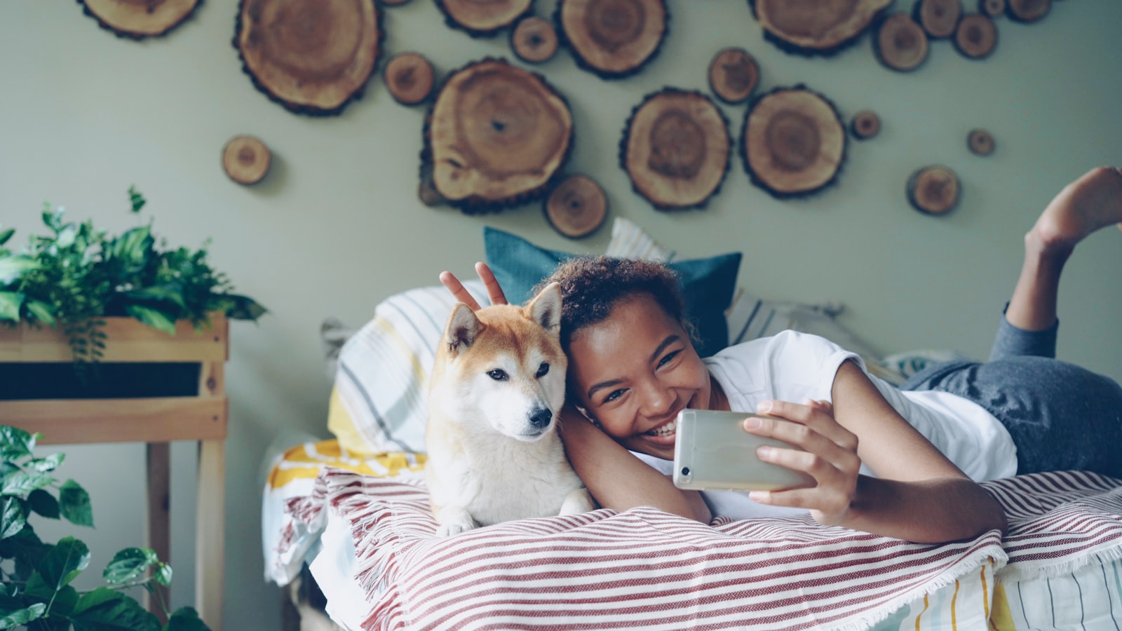 A woman takes a selfie with her dog.