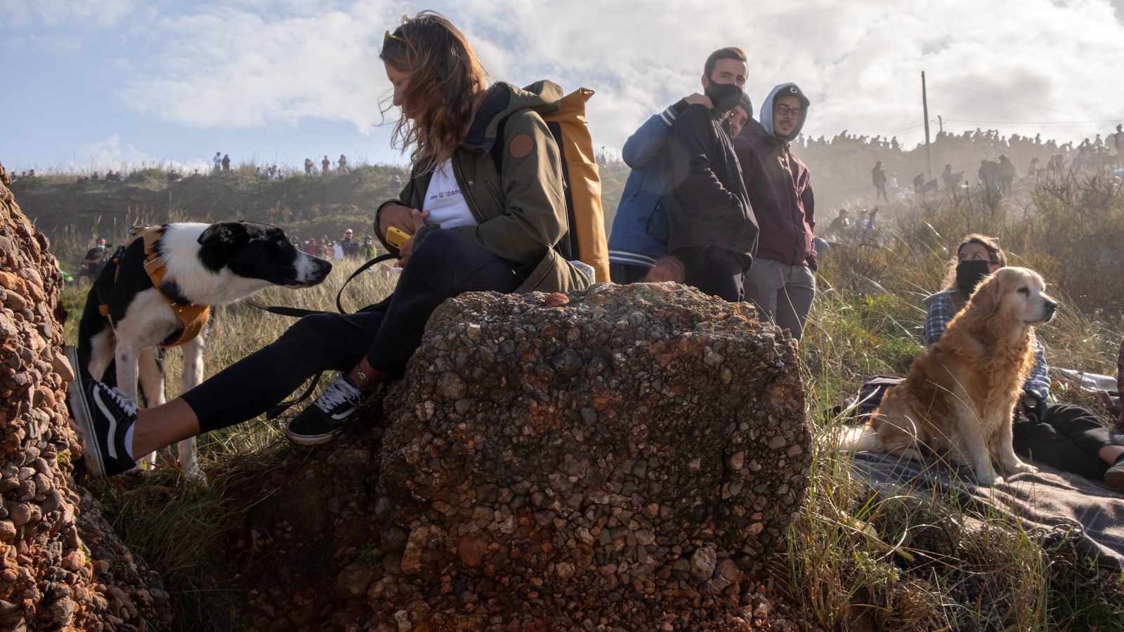 people sitting on rock during daytime